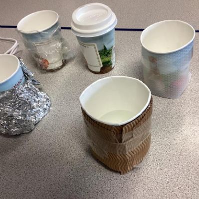 Year 5 have been comparative testing to investigate which material works best as a thermal insulator and will keep the teachers' coffee warmer for longer when they are on break duty.