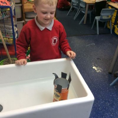 The children designed a boat and then tested to see if it floated or sank.