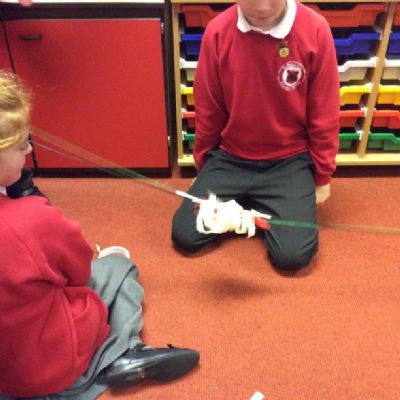 In the third science club, the children were challenged to launch balloon rockets.