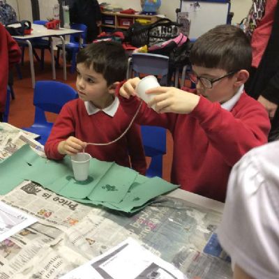 The Children were set the challenge of moving water with just a piece of string and 2 cups.