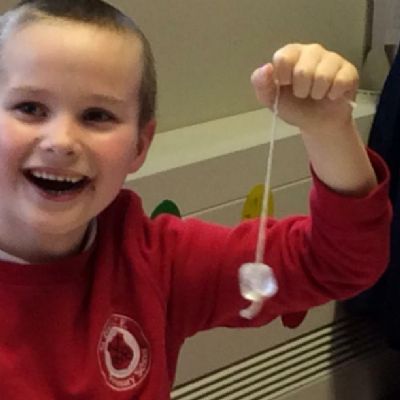 The children were set the challenge of lifting a piece of ice using only string and salt.