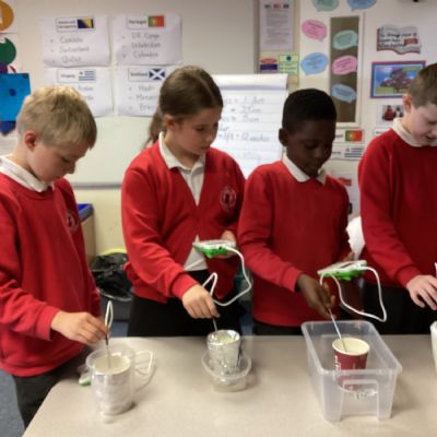 How can the teachers keep their coffee warm for longer?